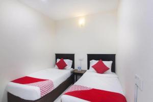 Postel nebo postele na pokoji v ubytování OYO 91130 Hotel 91 Bukit Mewah