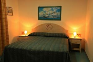 Postel nebo postele na pokoji v ubytování Hotel Oriente