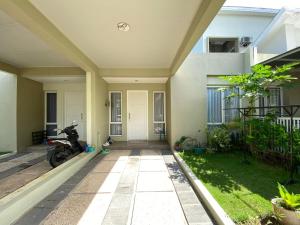 a motorcycle parked outside of a house at Entire House 2BR Nice Residence Batam Centre in Pulau Sembakau Besar