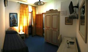 TV a/nebo společenská místnost v ubytování Hotel Oriente