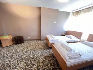 Postel nebo postele na pokoji v ubytování Park Hotel Kekava