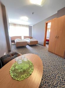 Postel nebo postele na pokoji v ubytování Park Hotel Kekava
