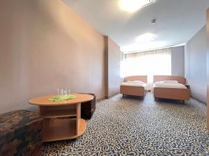 Postel nebo postele na pokoji v ubytování Park Hotel Kekava