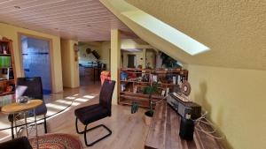 a living room with a couch and a table at Ferienwohnung Wiesental II, Wiesentalstrasse 1, 89331 Burgau in Burgau