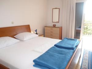Postel nebo postele na pokoji v ubytování Apartments Šarić