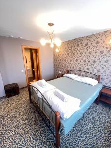 Postel nebo postele na pokoji v ubytování Park Hotel Kekava