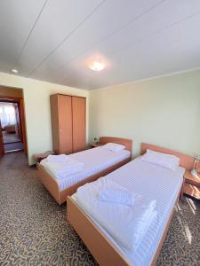 Postel nebo postele na pokoji v ubytování Park Hotel Kekava