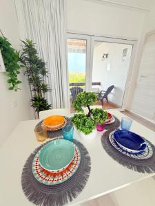 a table with plates of food on top of it at Vistamare Oltremare in San Cataldo