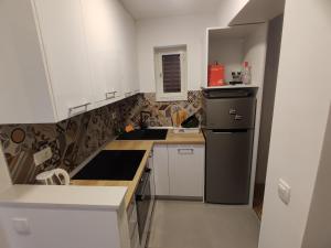 Kuchyň nebo kuchyňský kout v ubytování Apartments Šarić