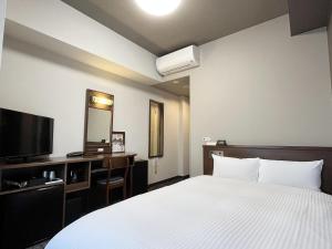 Postel nebo postele na pokoji v ubytování Hotel Route-Inn Toki