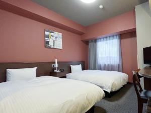 Postel nebo postele na pokoji v ubytování Hotel Route-Inn Toki