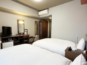 Postel nebo postele na pokoji v ubytování Hotel Route-Inn Toki