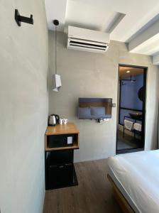 Postel nebo postele na pokoji v ubytování Just Inn Xin Yi 正旅館 信義