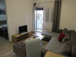 TV a/nebo společenská místnost v ubytování Aqua Lux Apartman