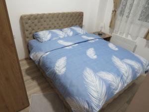 Postel nebo postele na pokoji v ubytování Aqua Lux Apartman