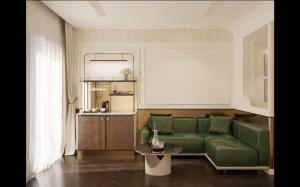 ホーチミン・シティにあるLa Passion Saigon Hotelのリビングルーム(緑のソファ、テーブル付)