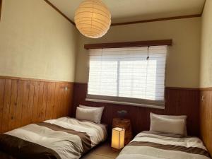 Postel nebo postele na pokoji v ubytování Heidi Guest House