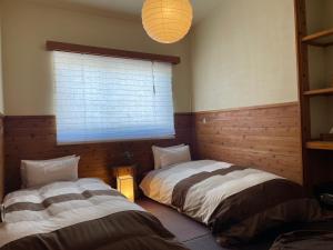 Postel nebo postele na pokoji v ubytování Heidi Guest House