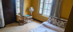 Postel nebo postele na pokoji v ubytování Heritage View Homestay