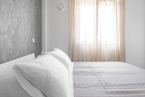 Postel nebo postele na pokoji v ubytování Hotel Bastione