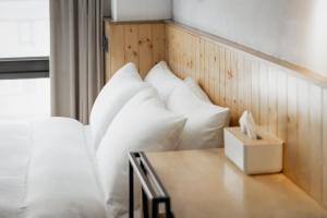 Postel nebo postele na pokoji v ubytování Just Inn Xin Yi 正旅館 信義