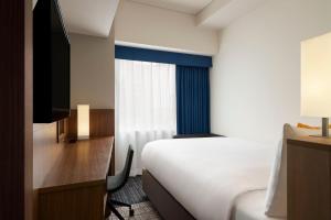 En eller flere senger på et rom på Four Points Flex by Sheraton Nagoya Station