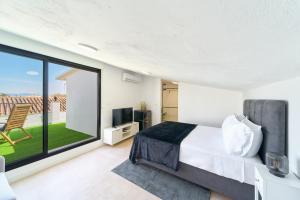 Μια τηλεόραση ή/και κέντρο ψυχαγωγίας στο Kosta Homes - Sunny Lux Loft Alhaurin Town Center