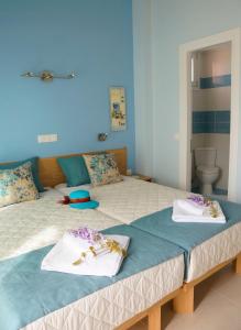 En eller flere senge i et værelse på Villa Roda Park Corfu