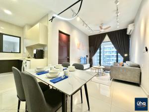 a dining room and living room with a table and chairs at Country Garden Empty in Johor Bahru