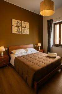 A bed or beds in a room at Camurria Sicilian B&B
