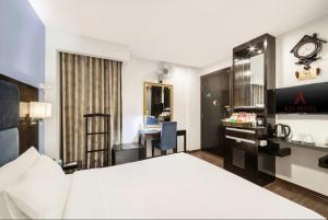 Postel nebo postele na pokoji v ubytování A25 Hotel - 28 Trần Quý Cáp + 9 fotografií