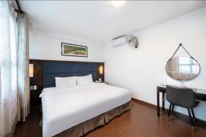 Ένα ή περισσότερα κρεβάτια σε δωμάτιο στο A25 Hotel - 28 Trần Quý Cáp