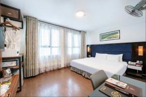 Ένα ή περισσότερα κρεβάτια σε δωμάτιο στο A25 Hotel - 28 Trần Quý Cáp