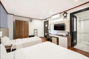 Ένα ή περισσότερα κρεβάτια σε δωμάτιο στο A25 Hotel - 28 Trần Quý Cáp