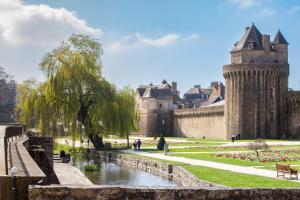 a castle with a river in front of it at Ty Gwened - Centre Historique - Calme - Wifi in Vannes