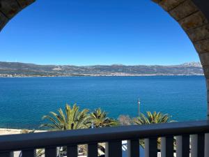 a view of the ocean from a balcony at Hotel Vila Tina in Trogir