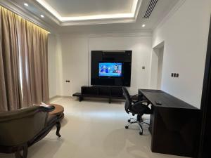 TV o dispositivi per l'intrattenimento presso Dibba Sea View Hotel by AMA Pro