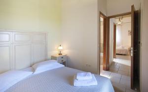 A bed or beds in a room at Asplathia Villas Lefkada