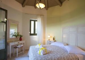 A bed or beds in a room at Asplathia Villas Lefkada