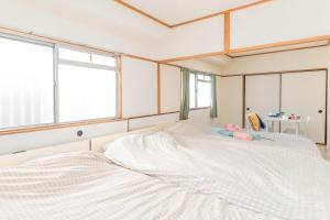 Tempat tidur dalam kamar di Namba Station about 15 minutes walk,Good location