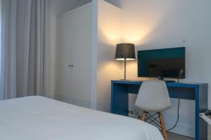Postel nebo postele na pokoji v ubytování Flag Hotel Santarém
