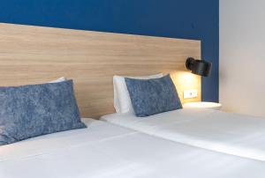 Postel nebo postele na pokoji v ubytování Flag Hotel Santarém