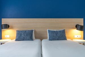 Postel nebo postele na pokoji v ubytování Flag Hotel Santarém