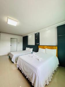 Katil atau katil-katil dalam bilik di Shiri Hotel