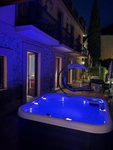 a large blue tub in a yard at night at Isoco House in Taormina
