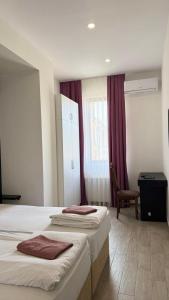 Postel nebo postele na pokoji v ubytování Star Hotel