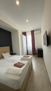 Postel nebo postele na pokoji v ubytování Star Hotel