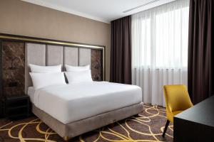 Postel nebo postele na pokoji v ubytování Card Hotel