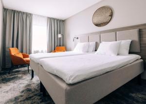 Ένα ή περισσότερα κρεβάτια σε δωμάτιο στο Best Western Plus Kalmarsund Hotell