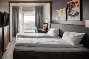 Letto o letti in una camera di Scandic Sarpsborg